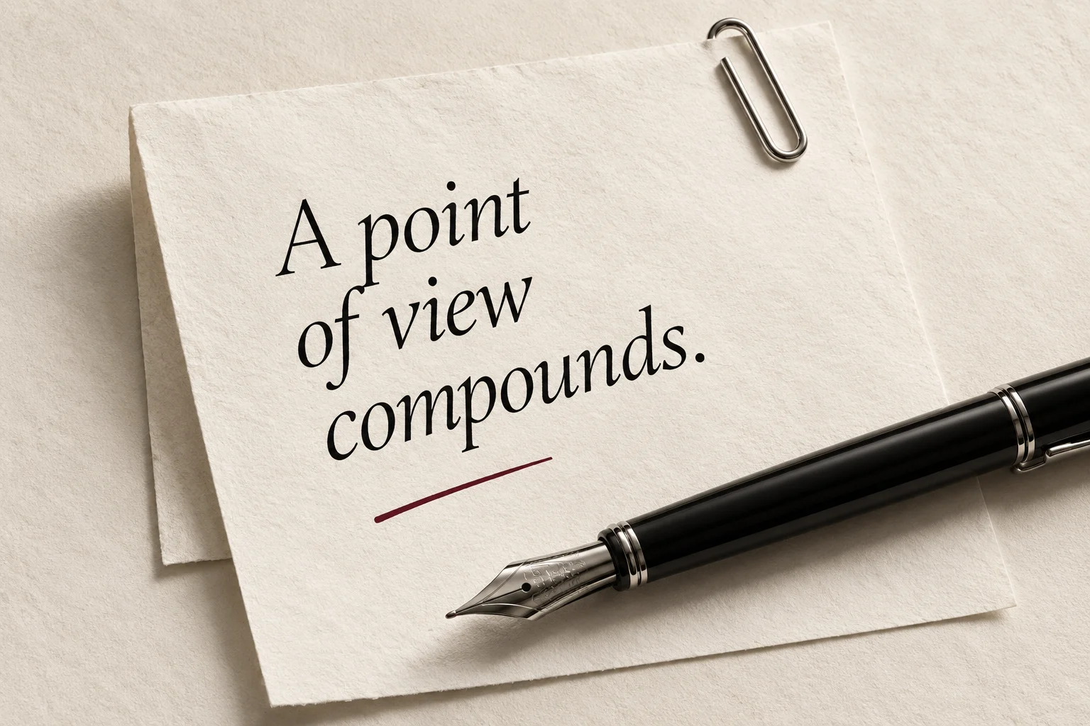A fountain pen and a paper note reading A point of view compounds