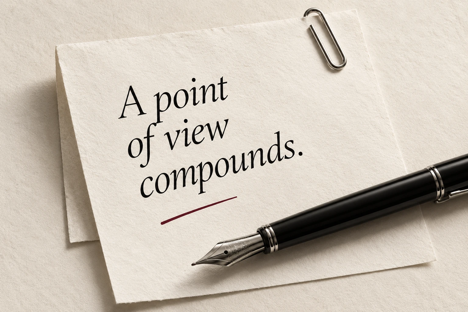 A fountain pen and a paper note reading A point of view compounds