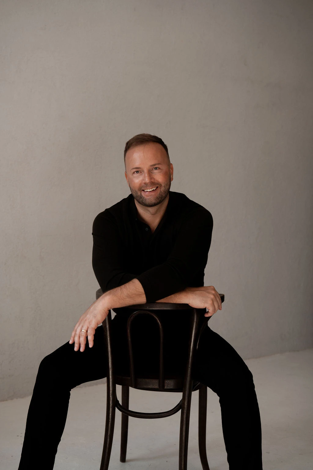 Martin Palmet sitting on a chair